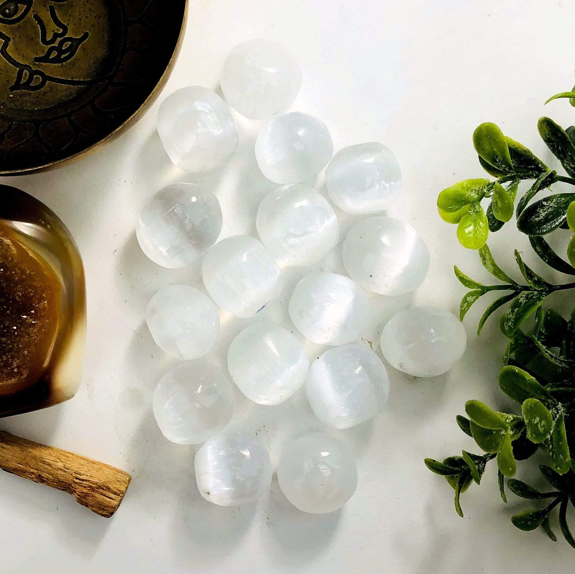 Selenite Tumbled Freeform stones on a table