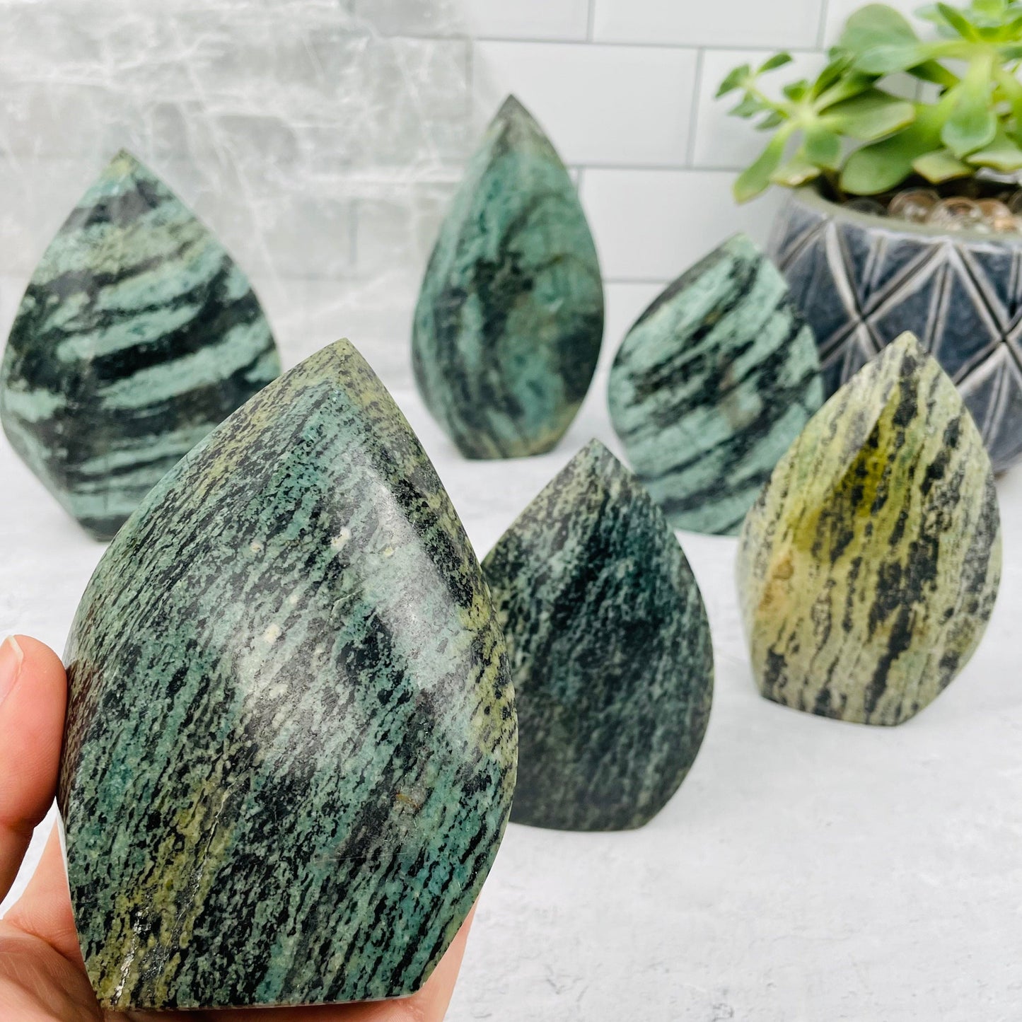 Green Snake Skin Jasper Flame in hand for size reference 