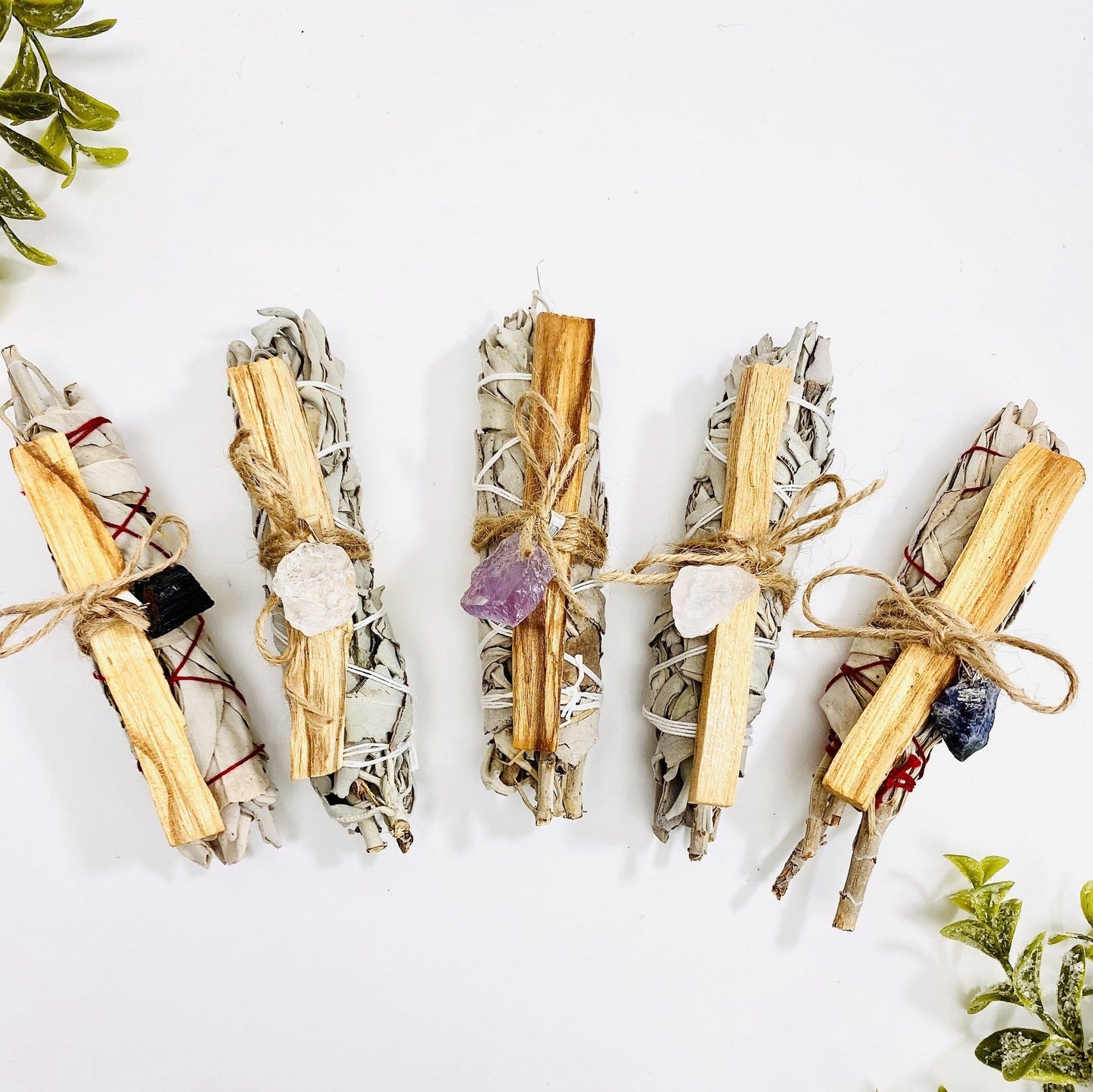 all sage palo santo bundle with stone pendant options on display