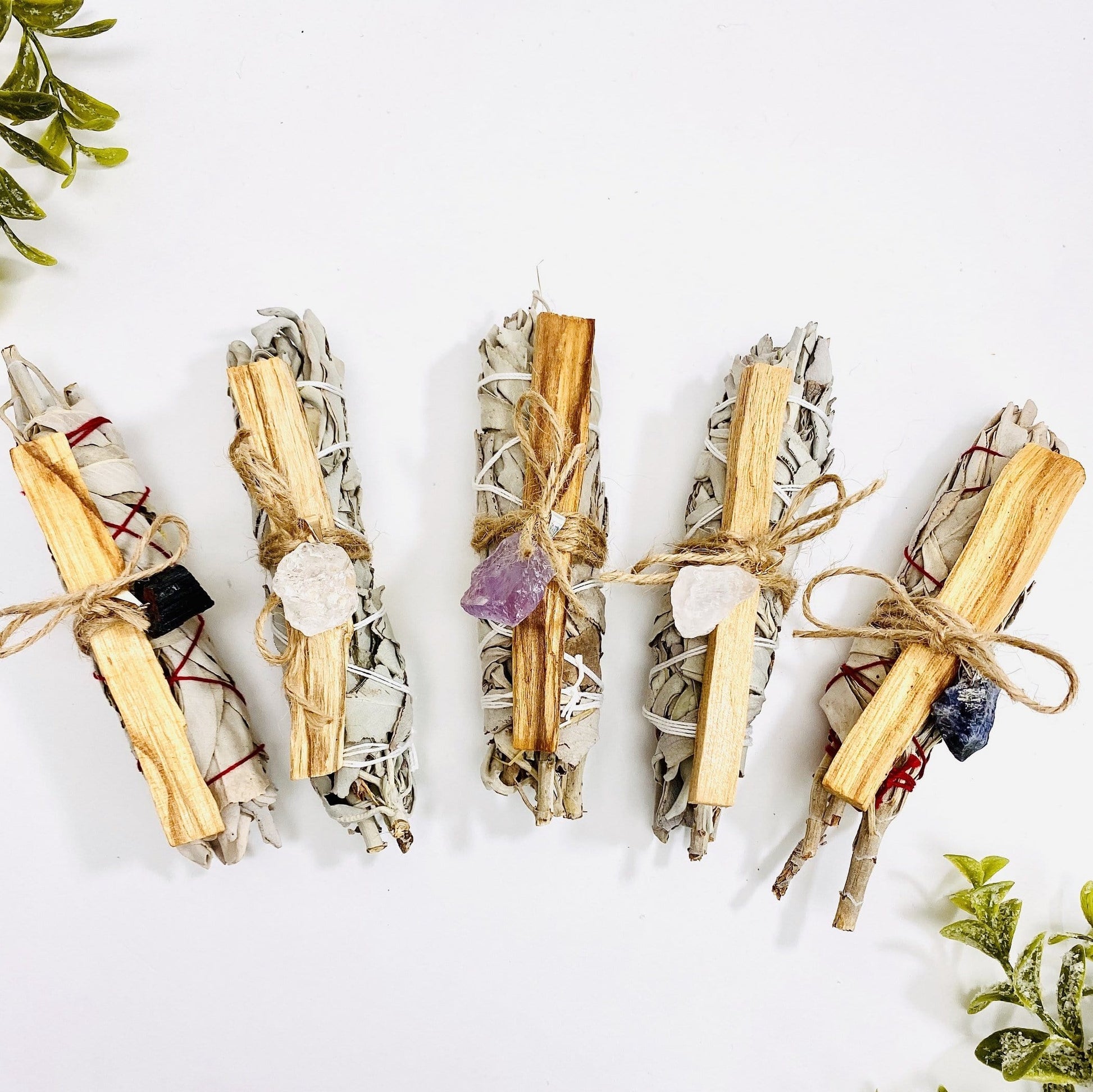 all sage palo santo bundle with stone pendant options on display
