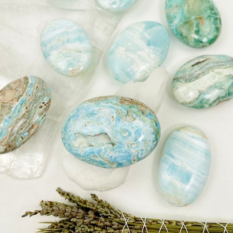 close up of blue aragonite also known as caribbean calcite palm stones to show details 