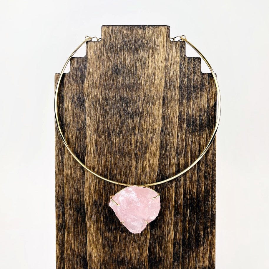 Rose Quartz choker on a wood stand