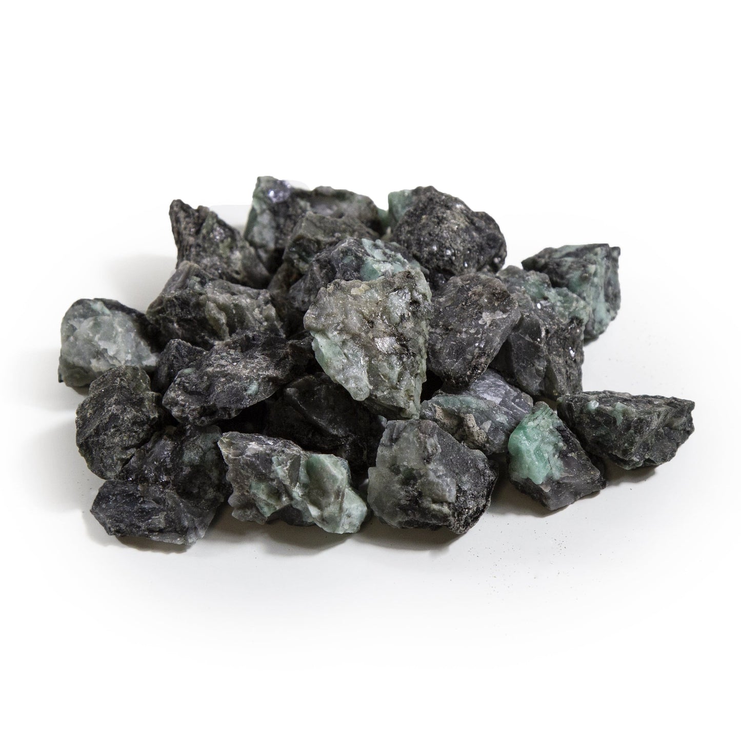 emerald rough stones with decorations in the background