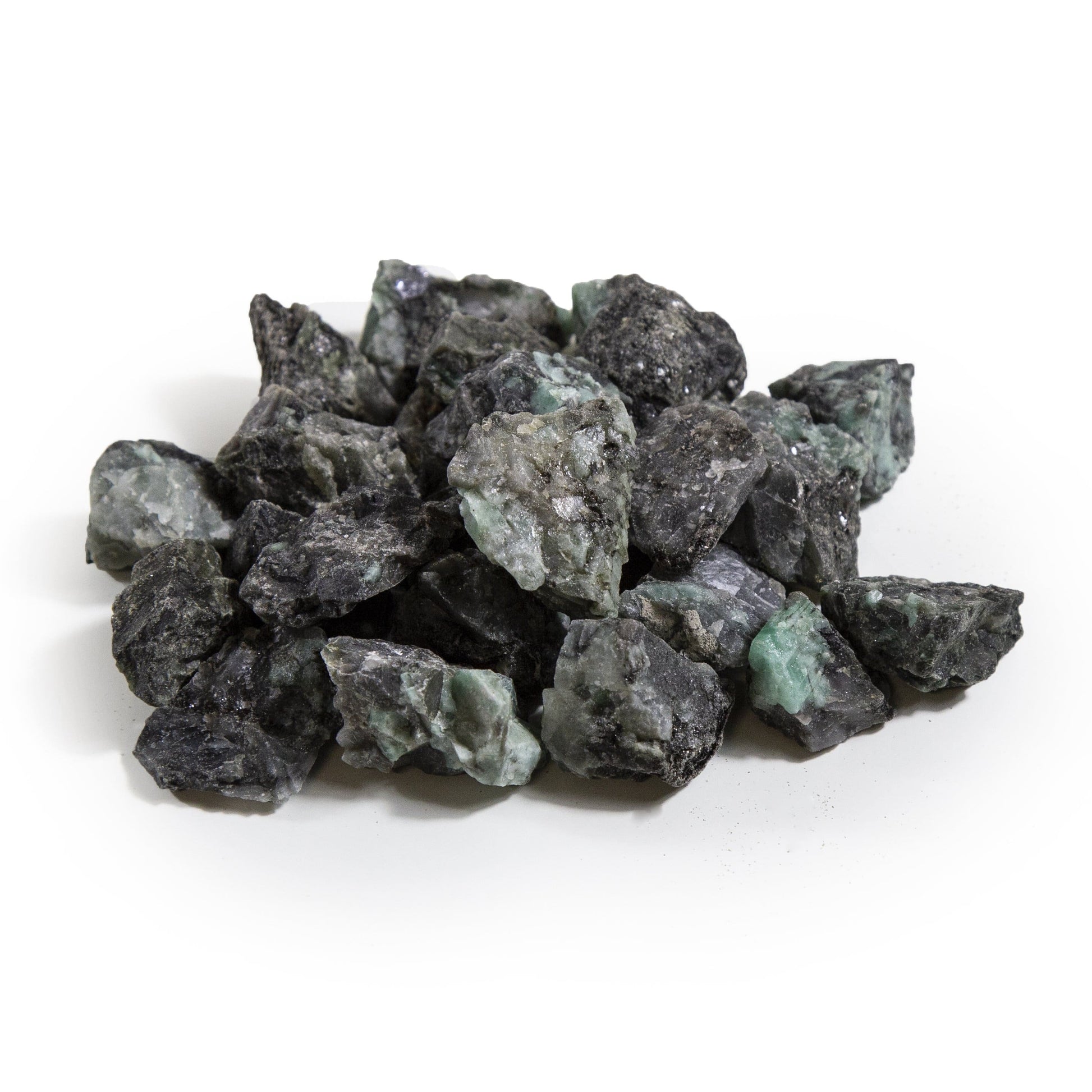 emerald rough stones with decorations in the background