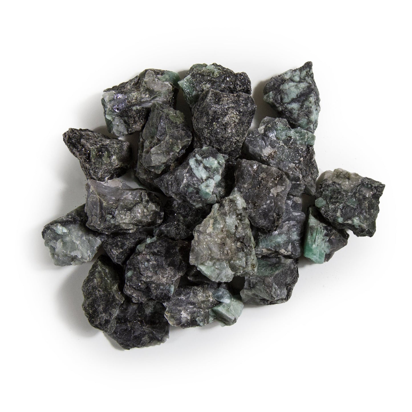 emerald rough stones with decorations in the background