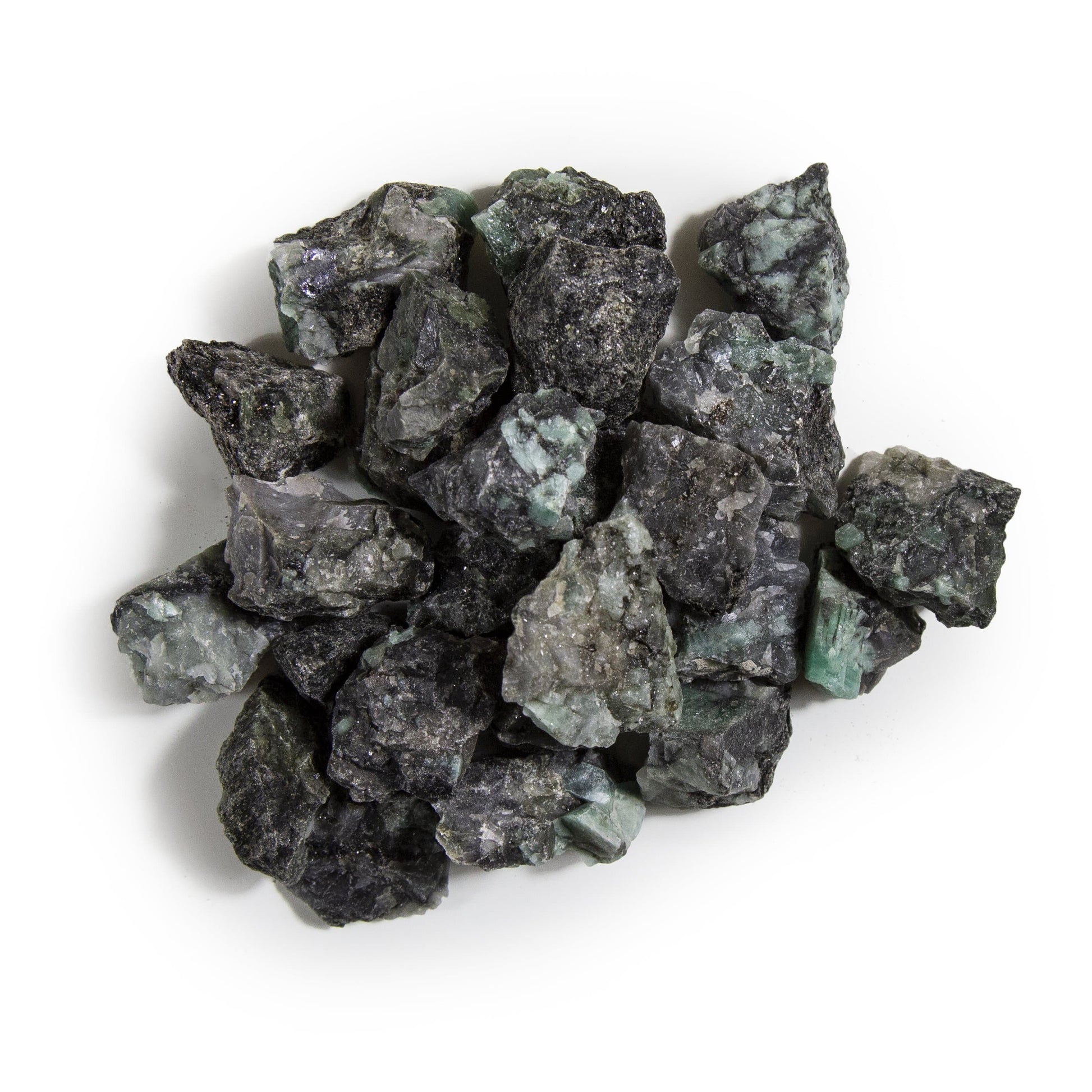 emerald rough stones with decorations in the background