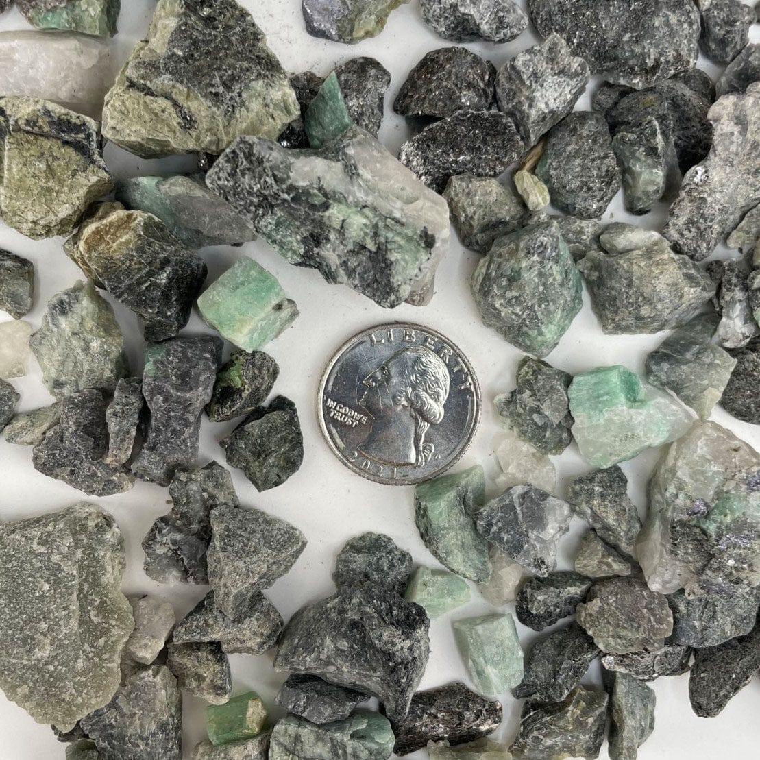 Emerald Stones with a quarter for size