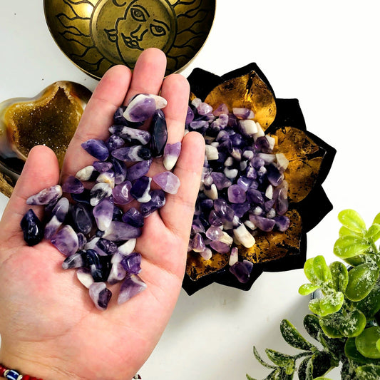 chevron amethyst small tumbled stones in hand for size reference 