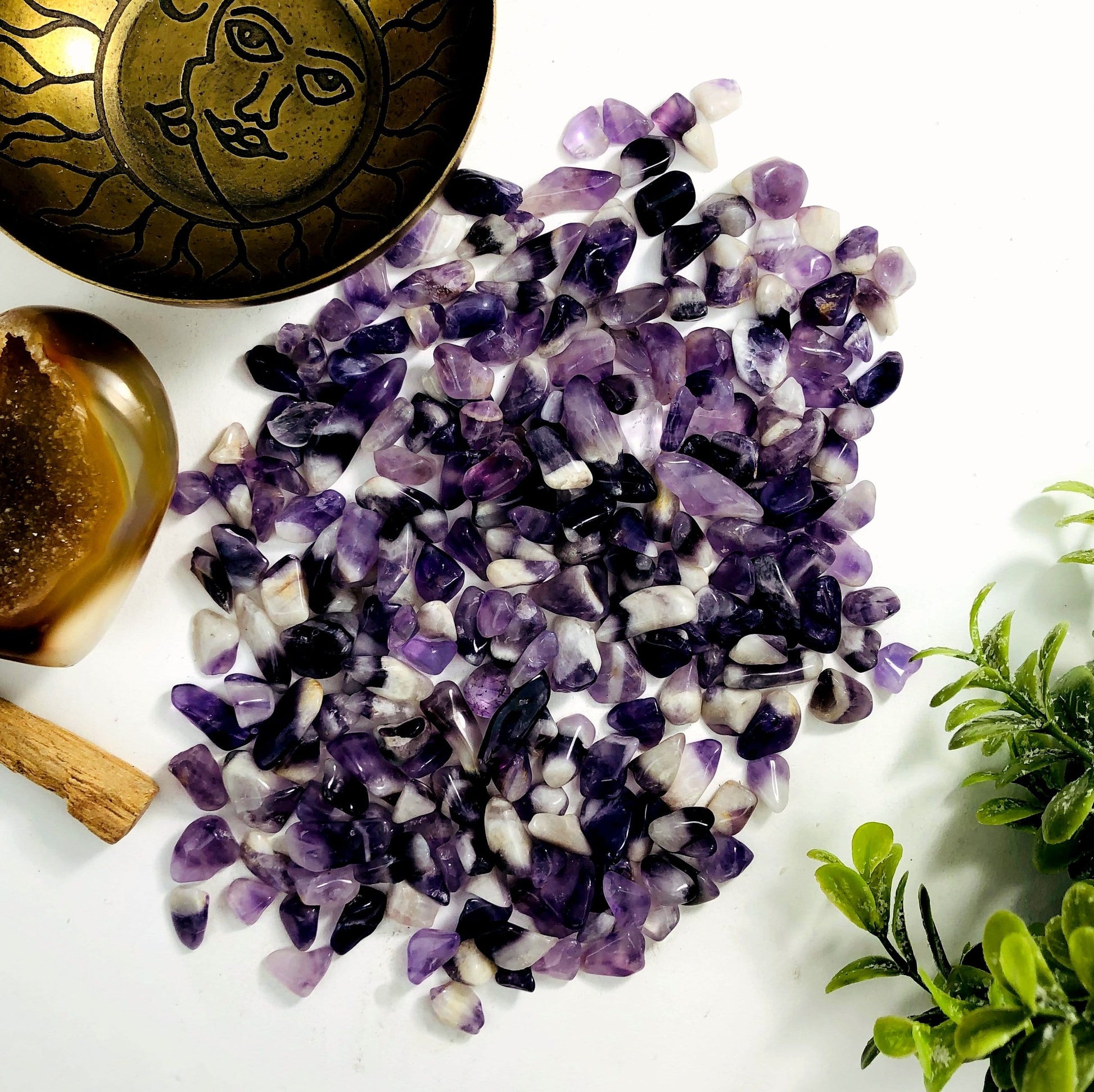 half pound of chevron amethyst small tumbled stones on white background 