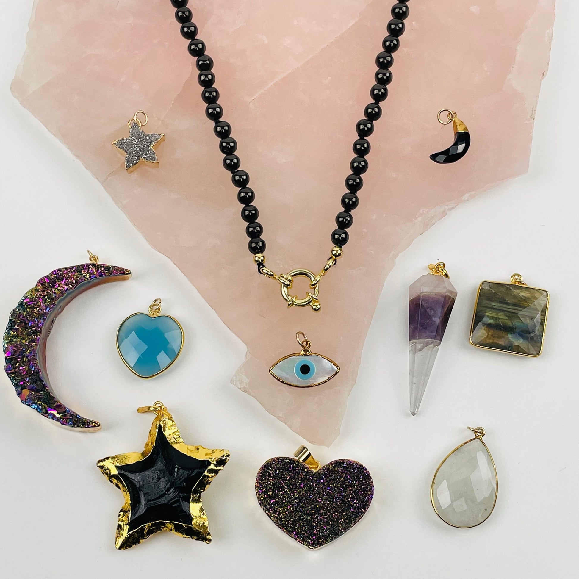 up close shot of Shungite Candy Necklace with charms surrounding it