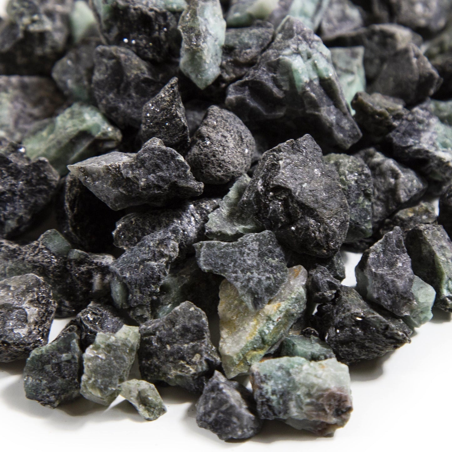 Close Up of Close up of Emerald Rough Stones on white background.