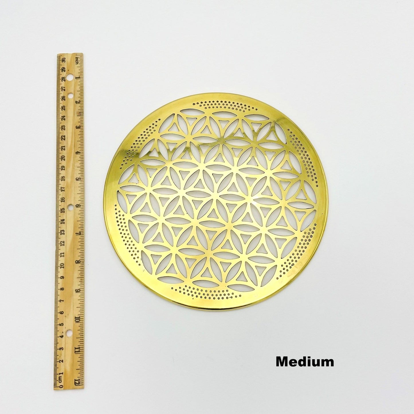 flower of life grid available in medium size. displayed next to a ruler for size reference
