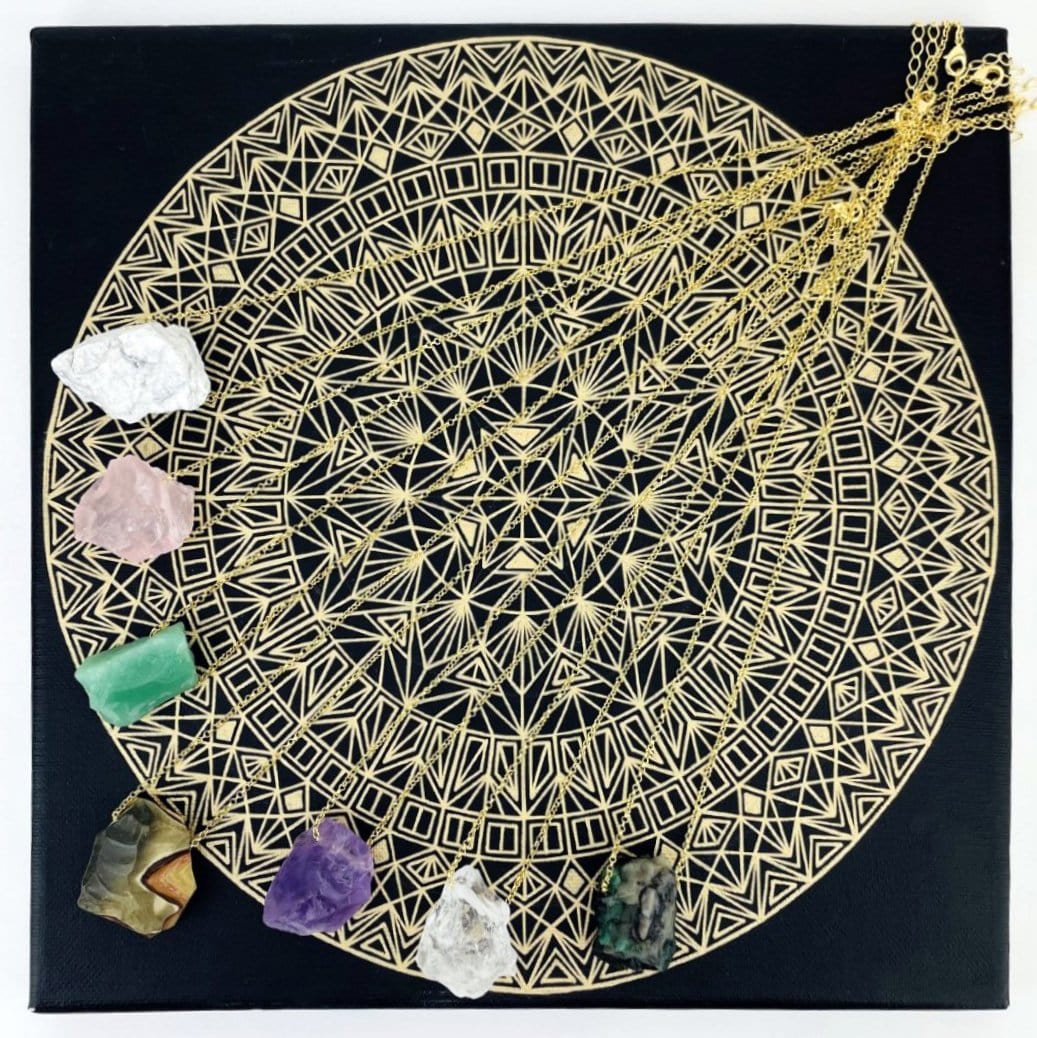 Healing Stone Necklaces with gold chain on crystal grid