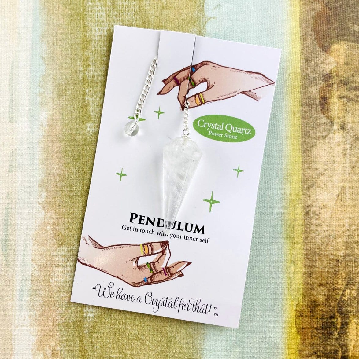 crystal quartz crystal pendulum on information card