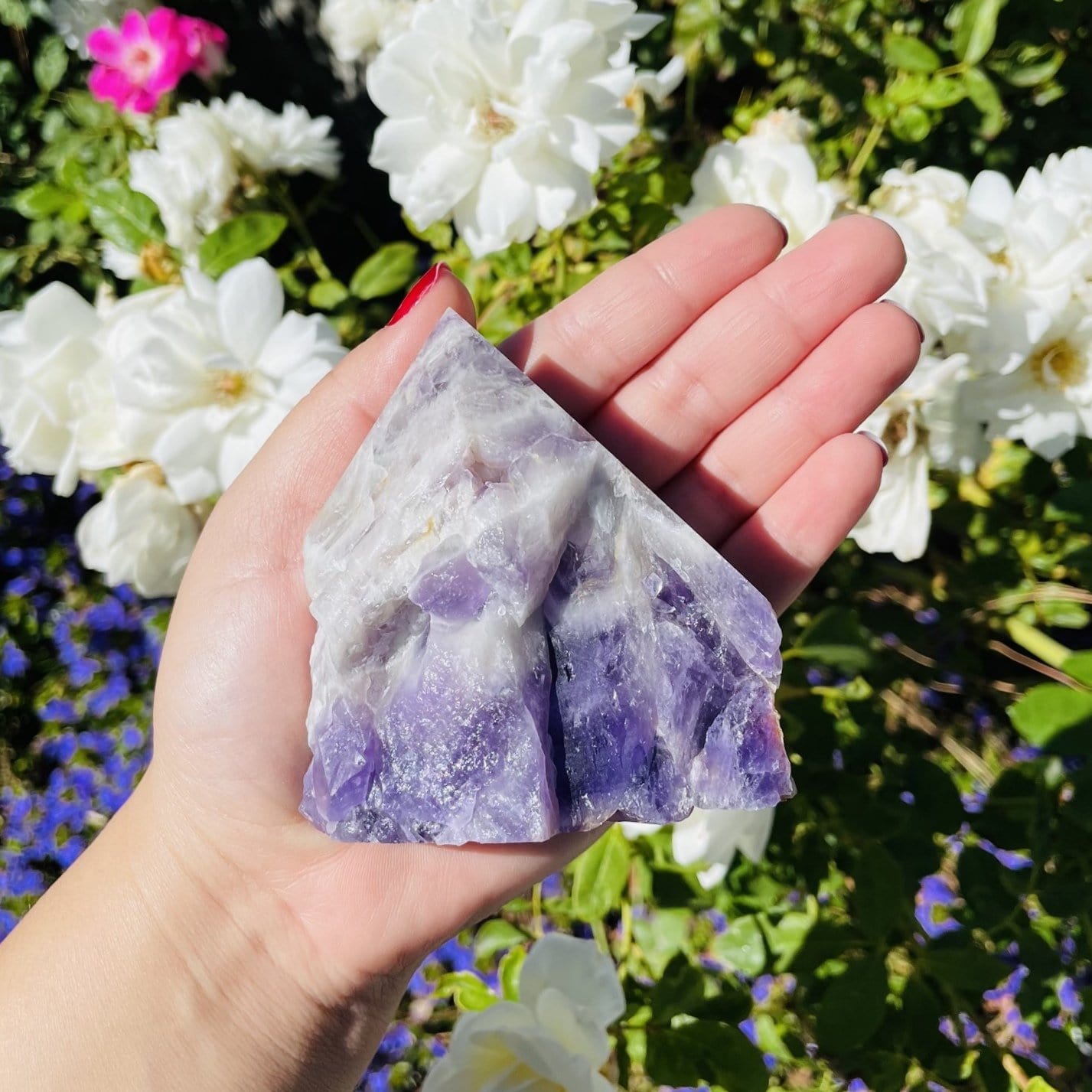 chevron amethyst polished point in hand for size reference 