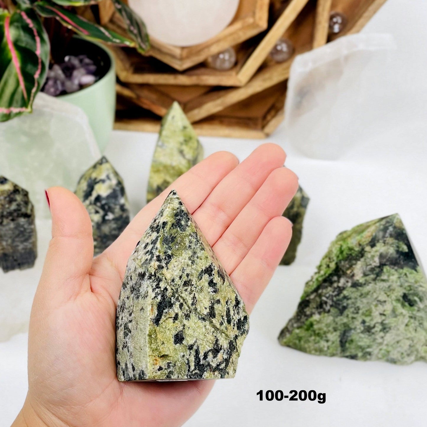 100-200g sized Jadeite Semi-polished Point displayed in hand.