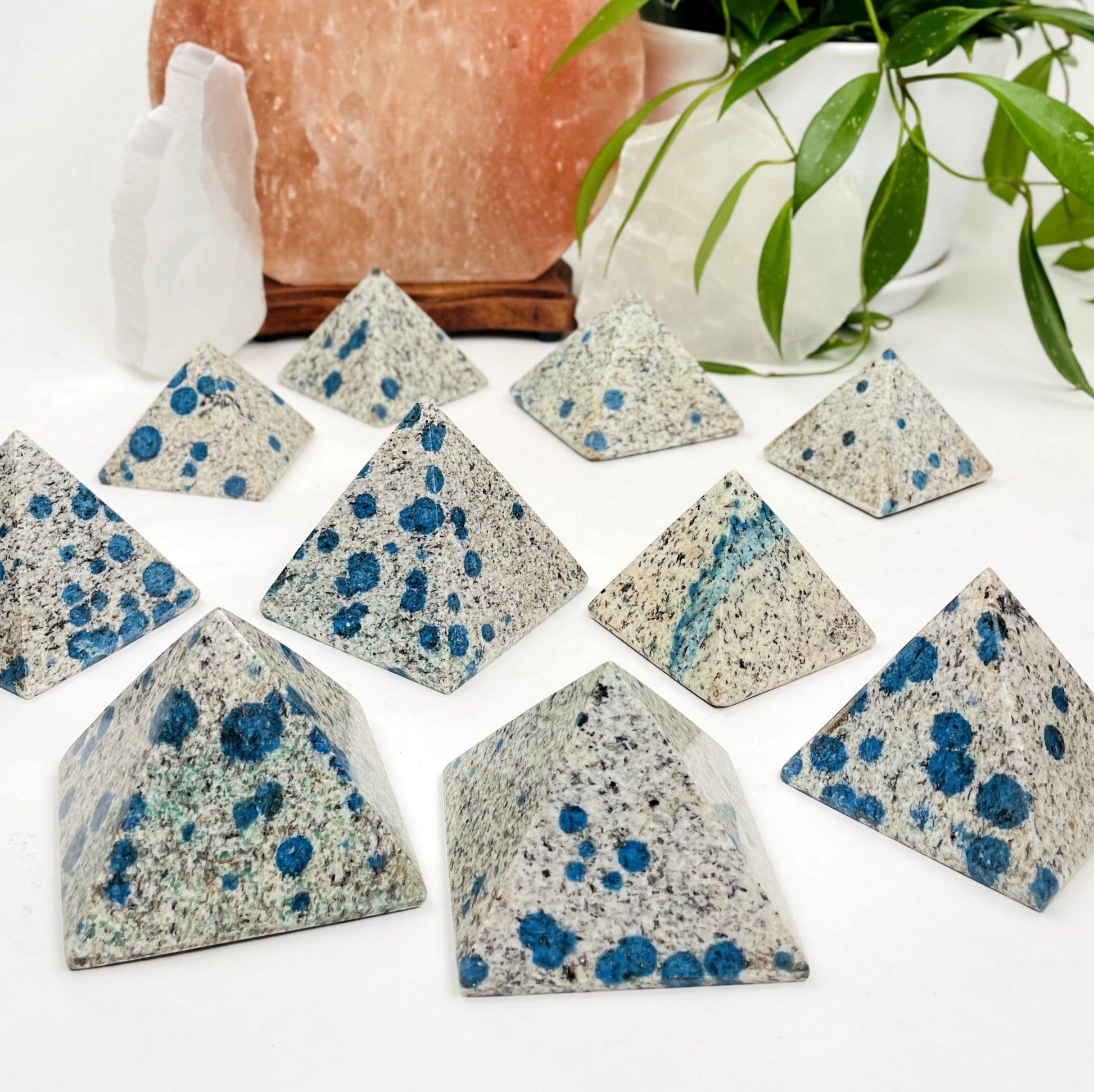 10 k2 pyramids on white background they are white with black and blue speckled design