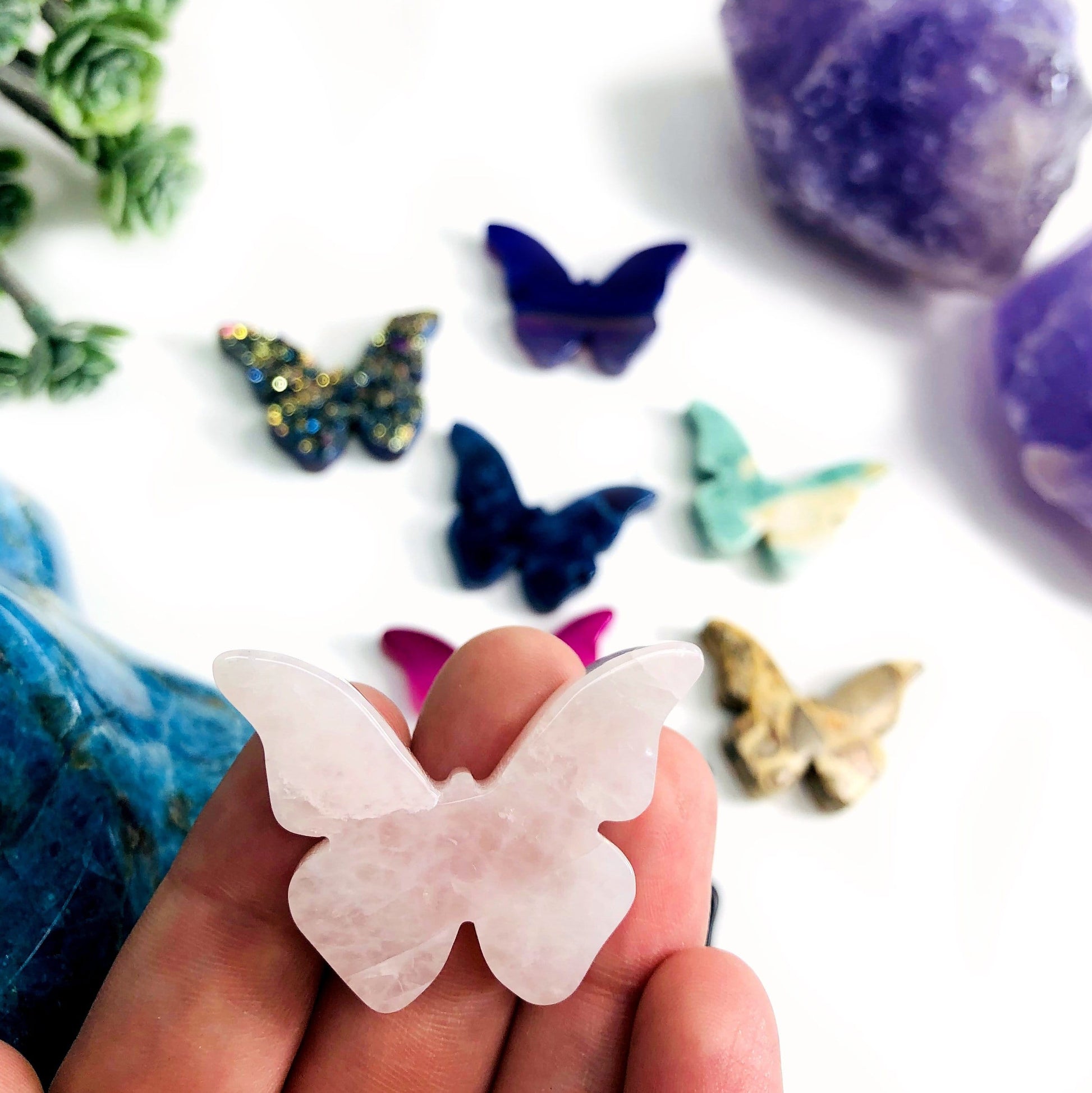 Up close of Rose Quartz Butterfly Gemstone Cabochon, in hand