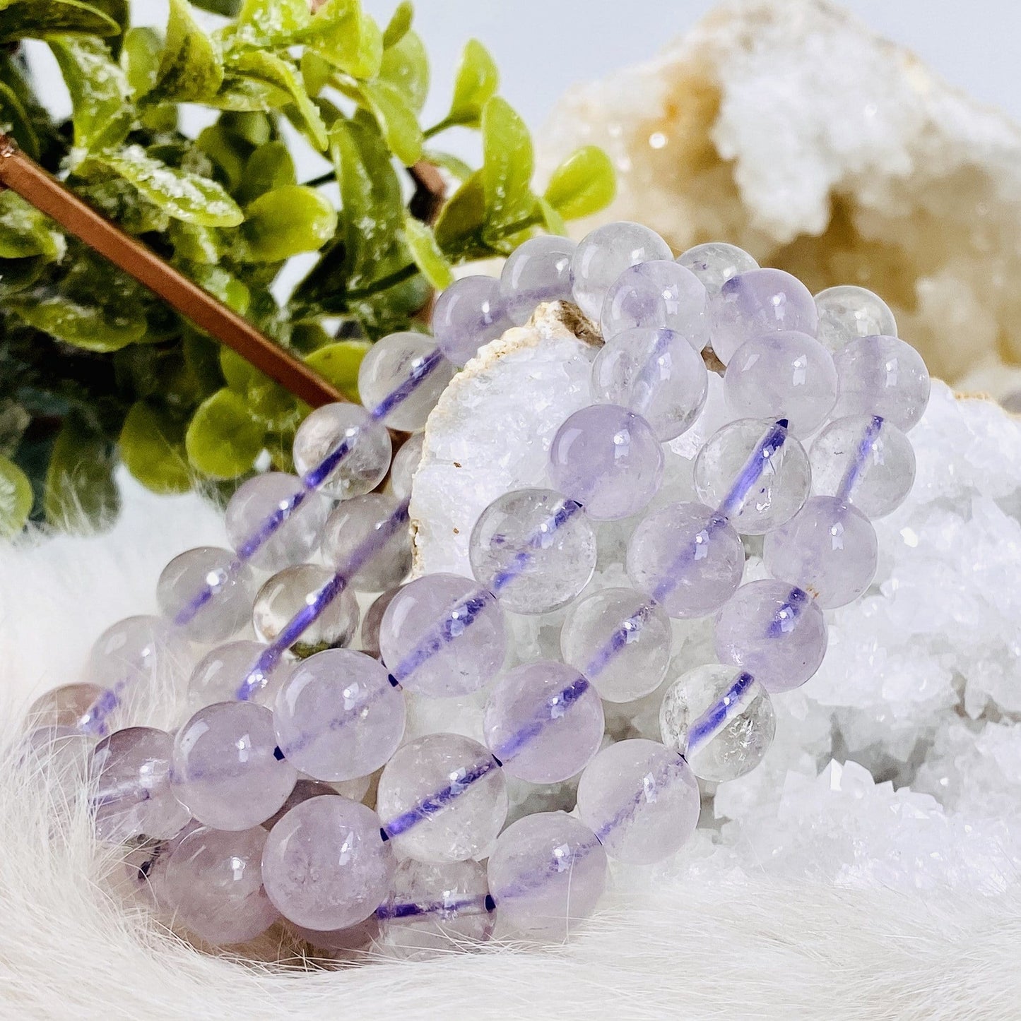 light amethyst round bead bracelets stacked up