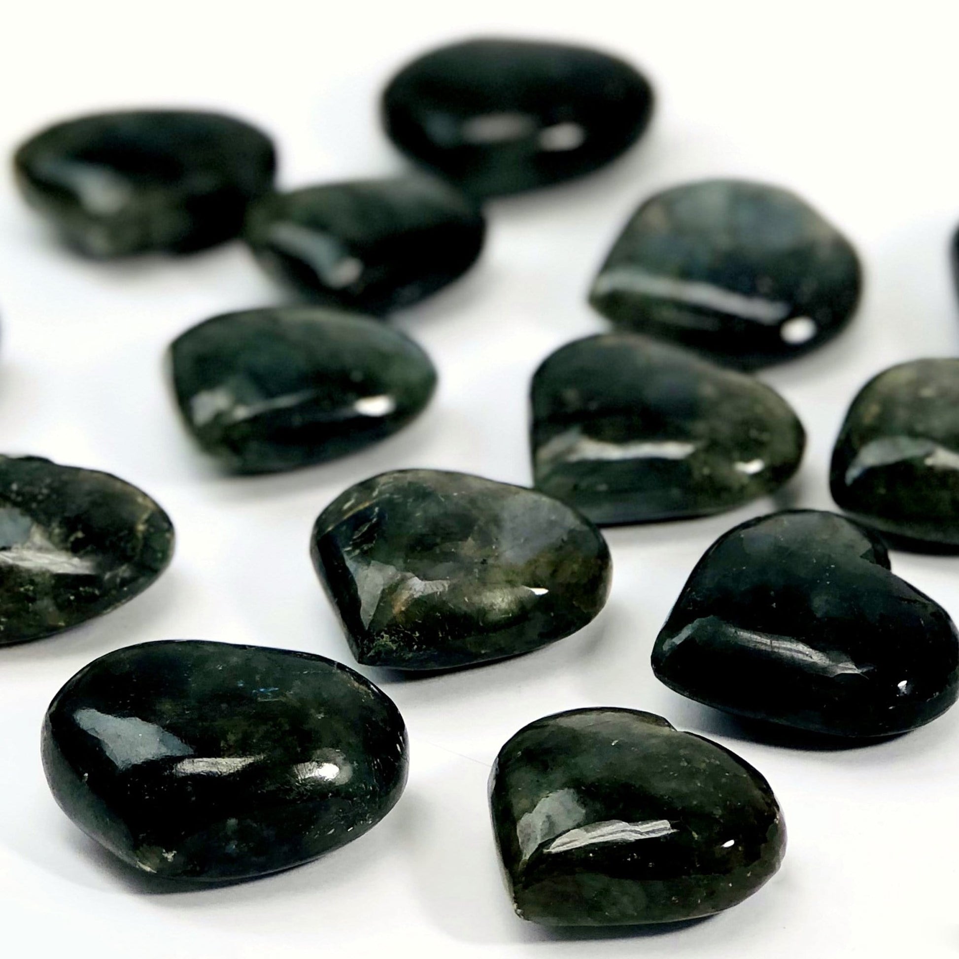 side shot of labradorite hearts showing the different thicknesses 