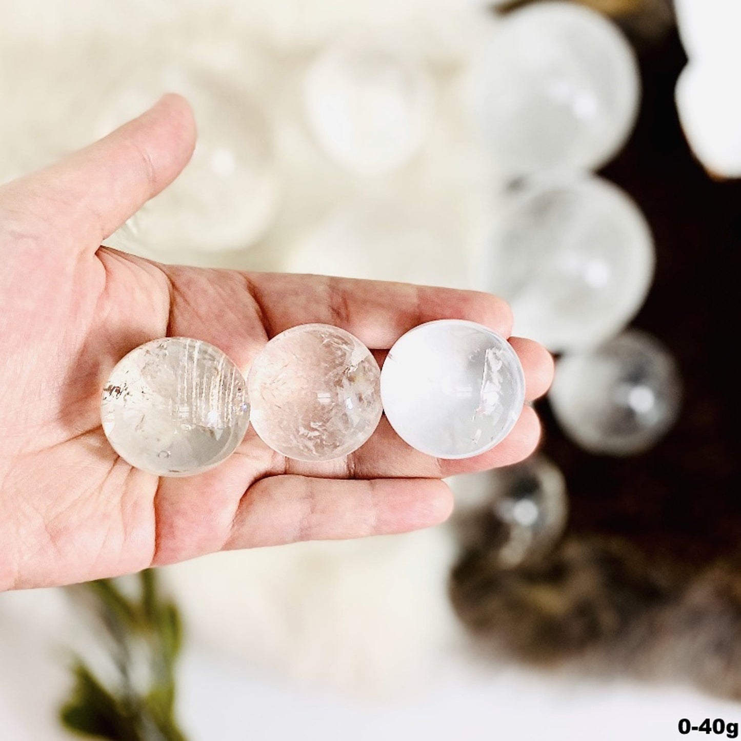 0-40g spheres displayed in hand for size reference