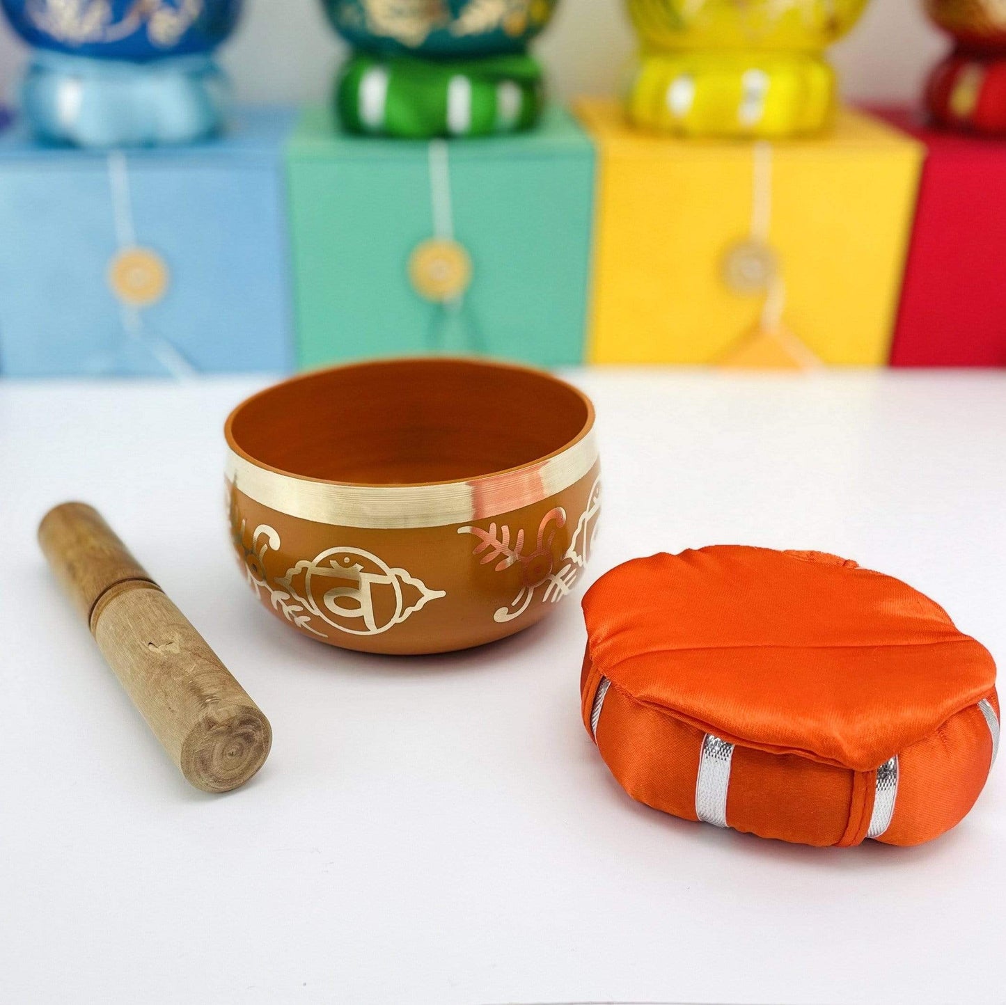 a side view of Brass Tibetan Chakra Singing Bowl, mallot and pillow