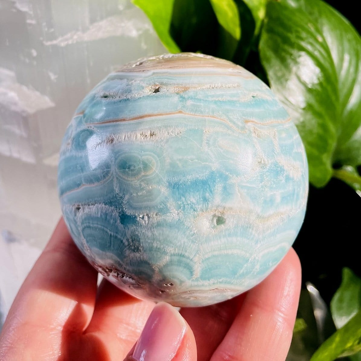 Blue Aragonite Spheres - Also known as Caribbean Calcite shown upclose in a hand