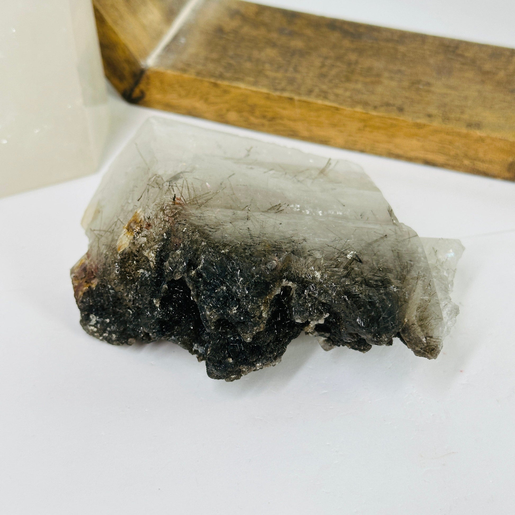 rutile quartz with decorations in the background