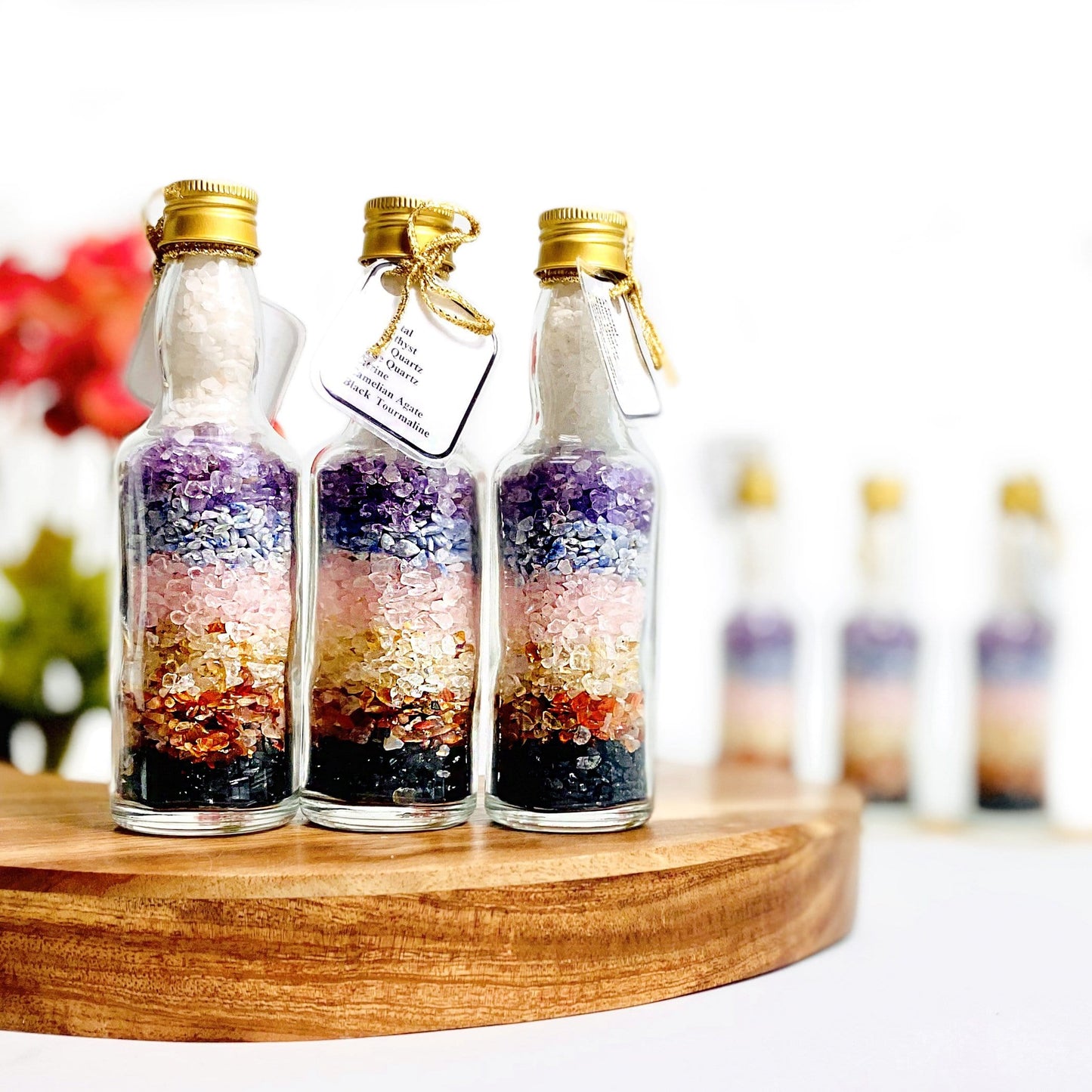 3 bottles with chakra stones