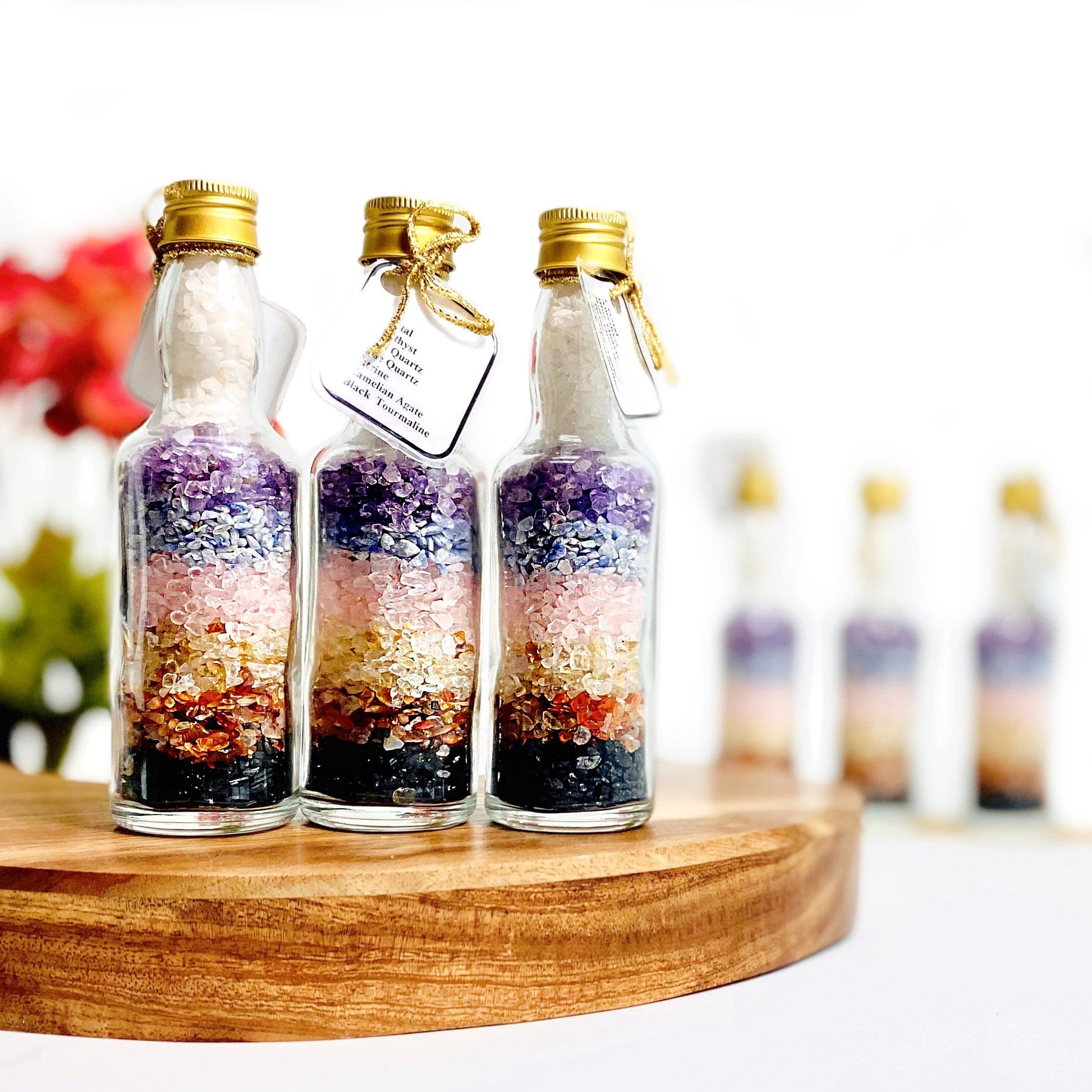 3 bottles with chakra stones