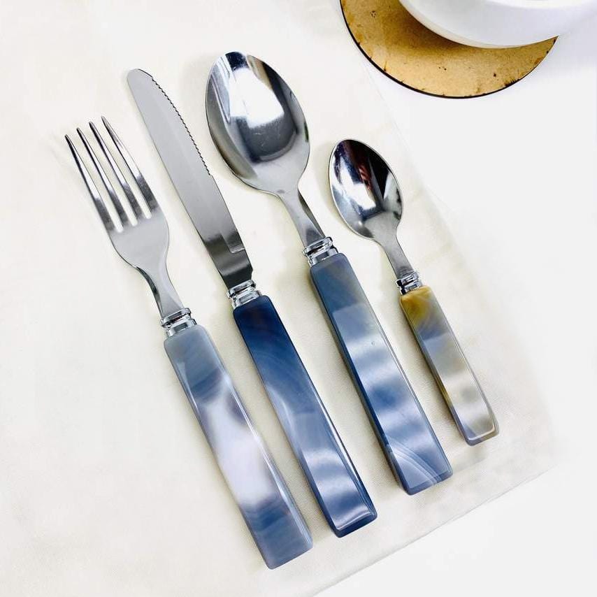 This is a picture of The set, Which comes with a Fork, Knife, Spoon and Tea Spoon. 