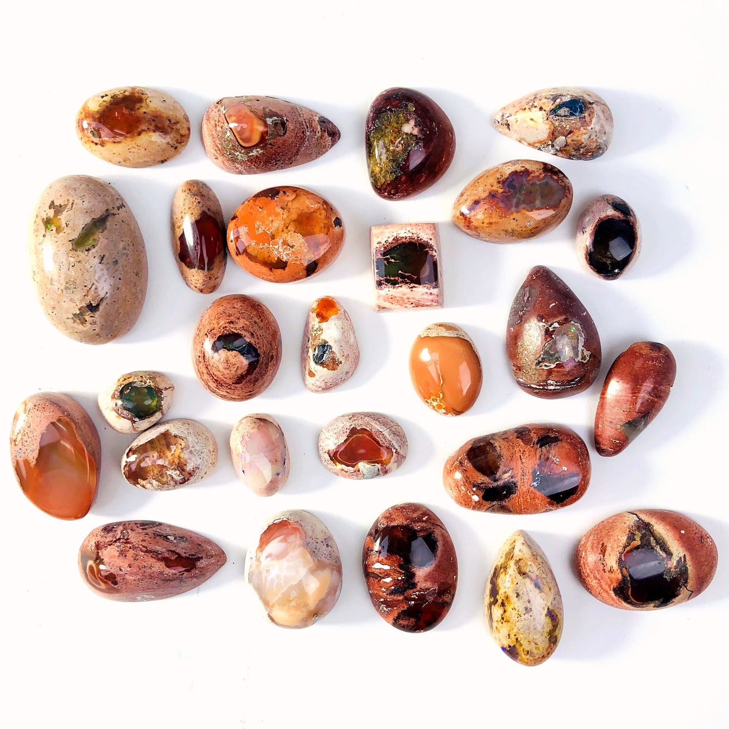 Opal Cabochons Mexican Fire Opal - several on a table