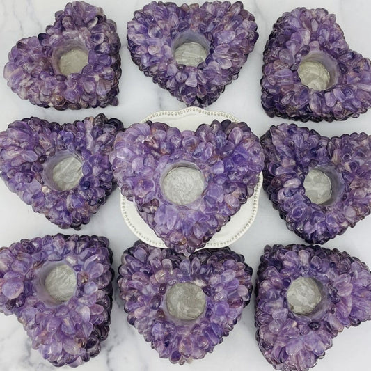 9 amethyst tumbled stone heart candle holders on marble background