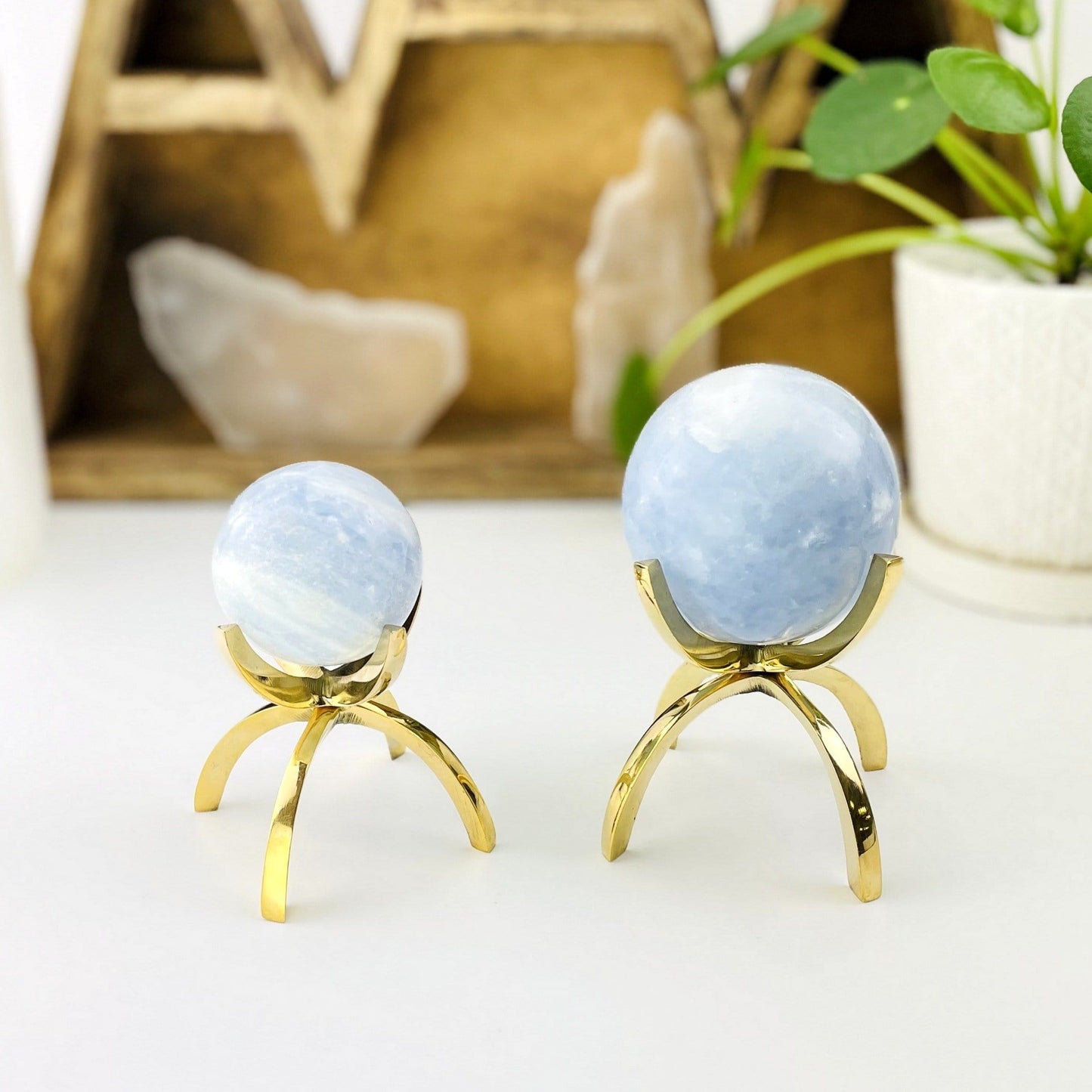 brass stand with spheres on them