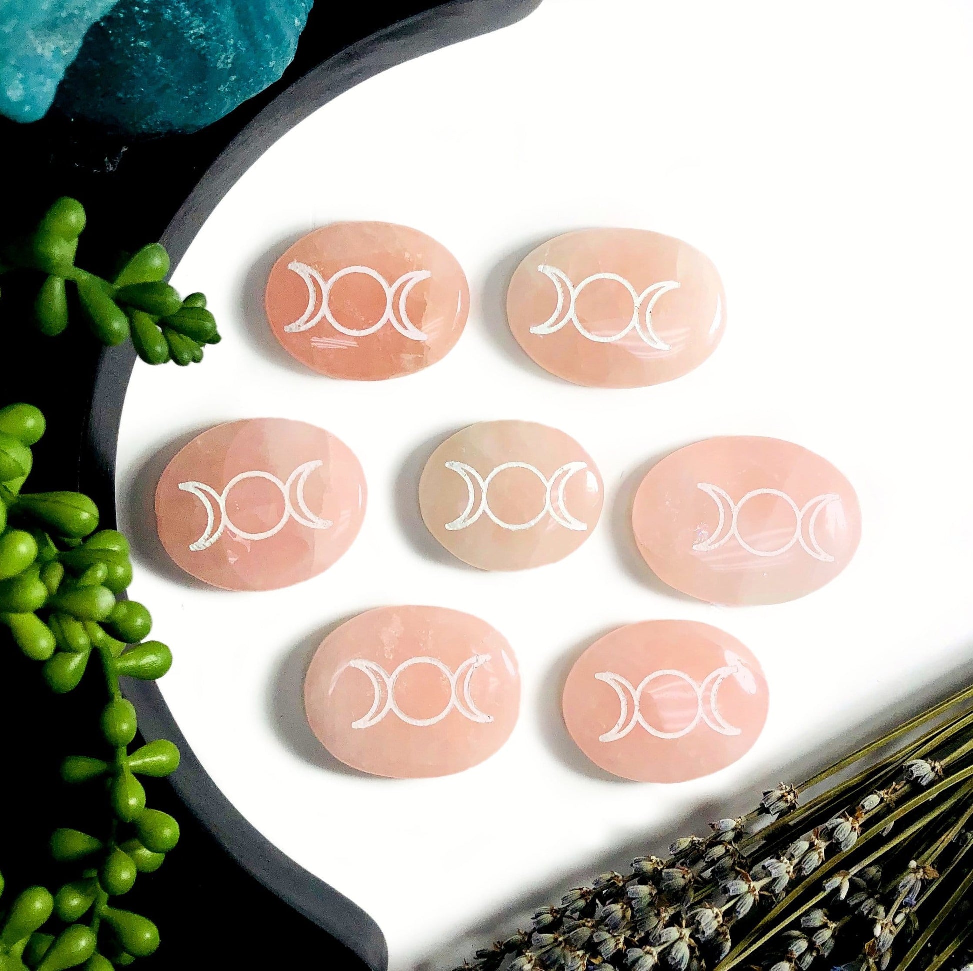 Multiple Rose Quartz Palm Stones Pocket Stones with Moon Phase in white background