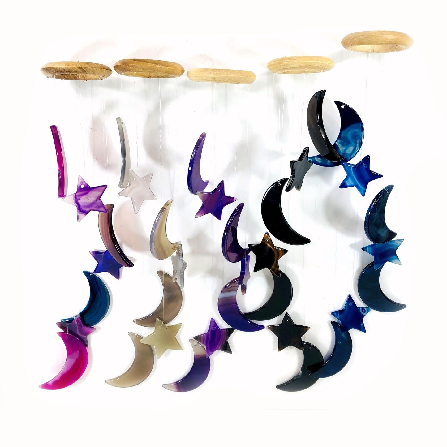 Five different agate moon and star wind chimes shown hung with a white background.