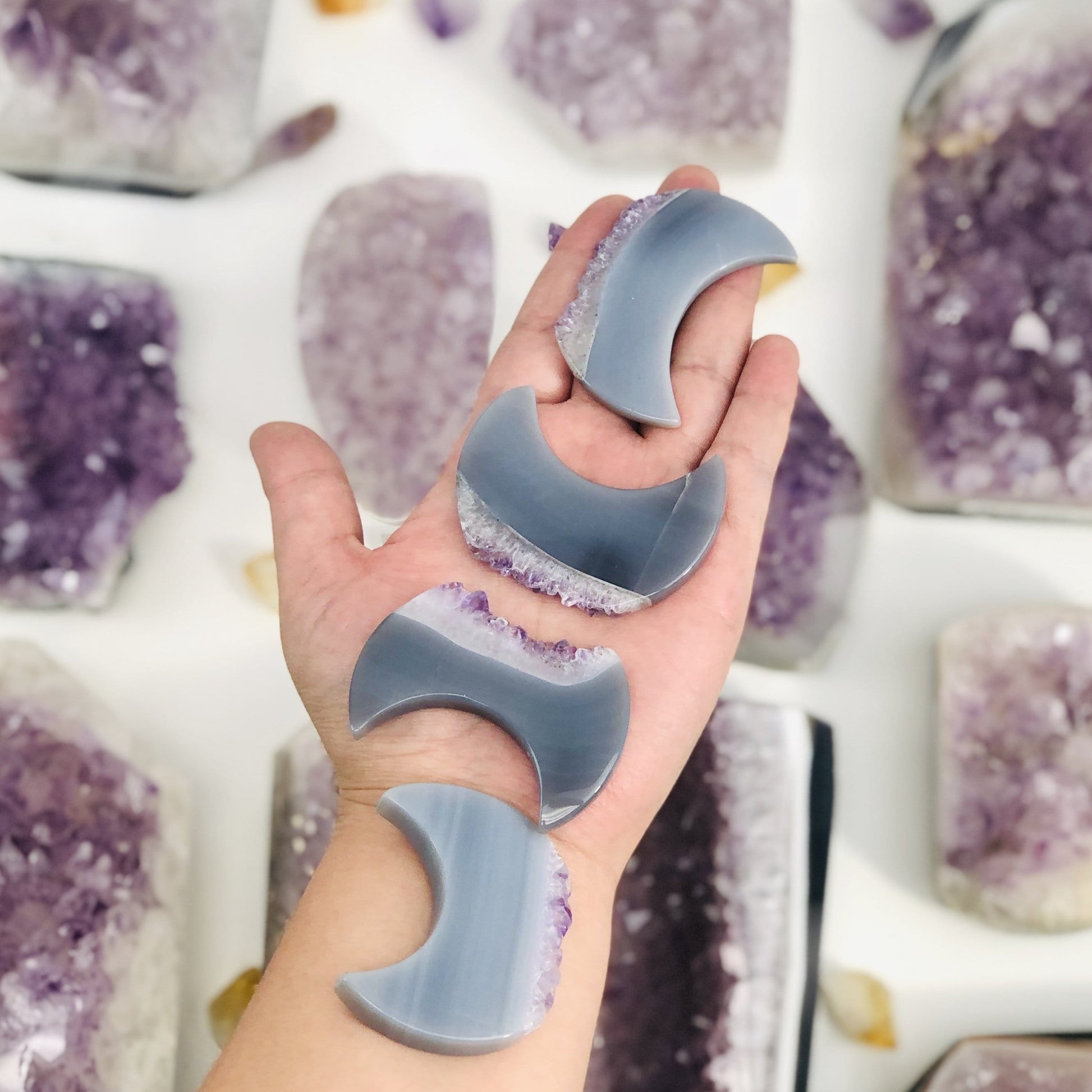 multiple Large Amethyst Half Moons 60mm Undrilled  displayed in hand for size reference