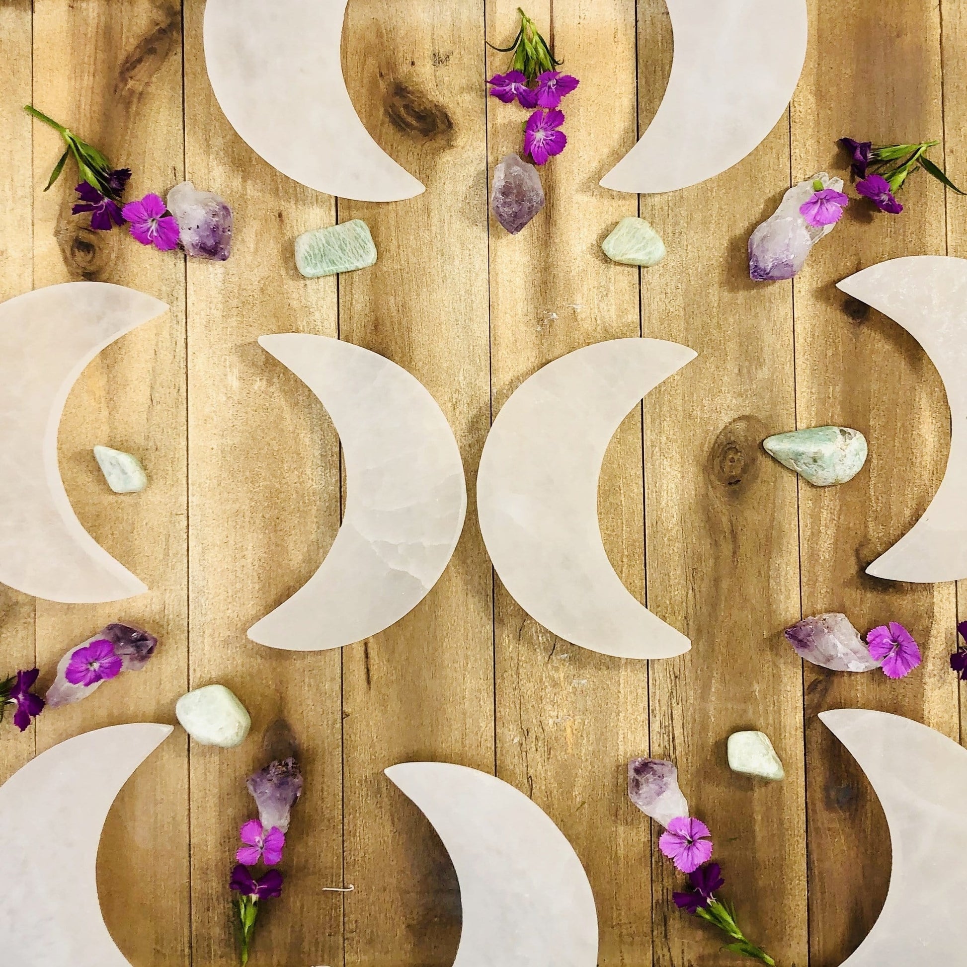 multiple selenite moons set as home decor 