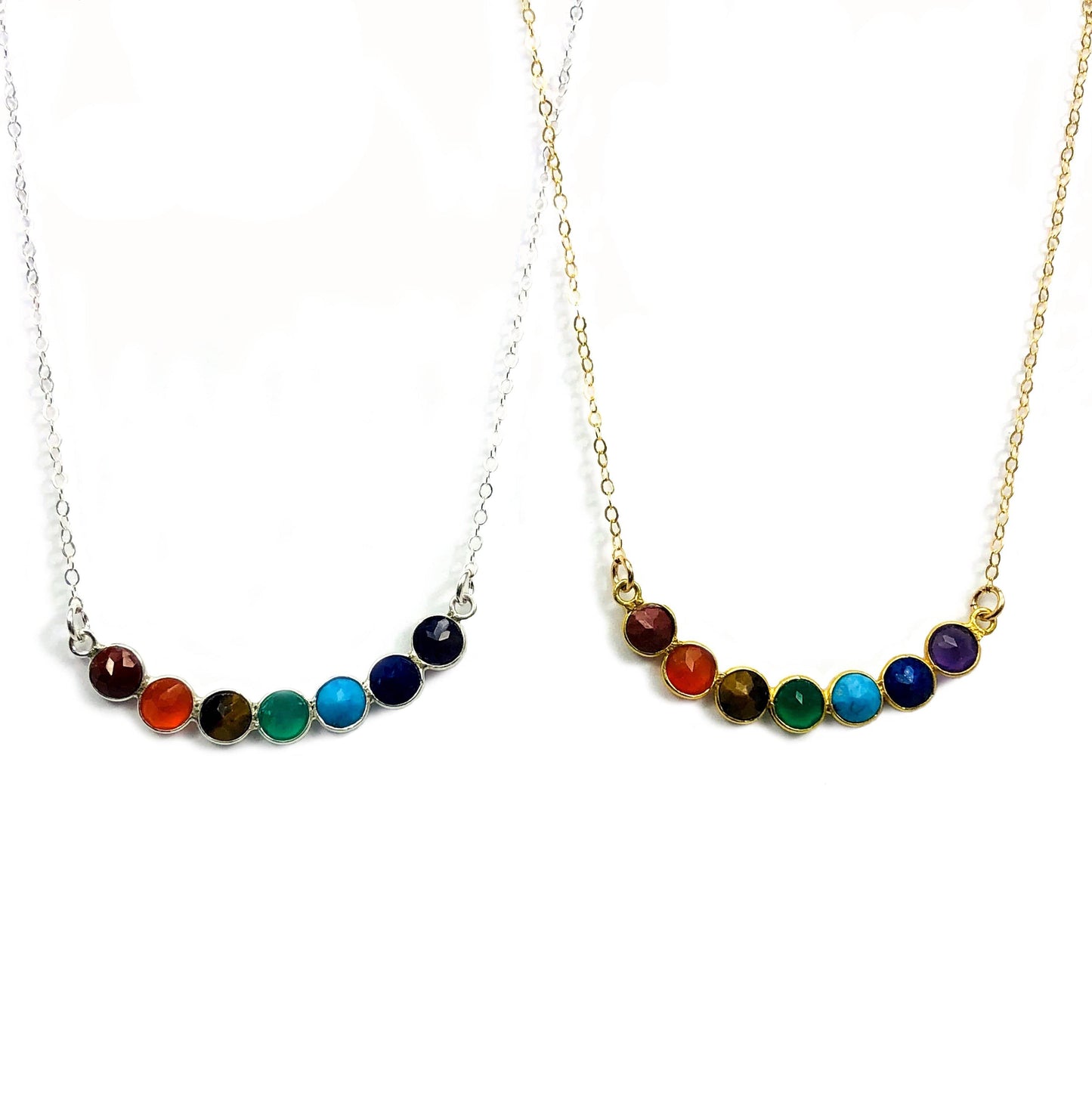 chakra necklaces displayed in gold and silver 