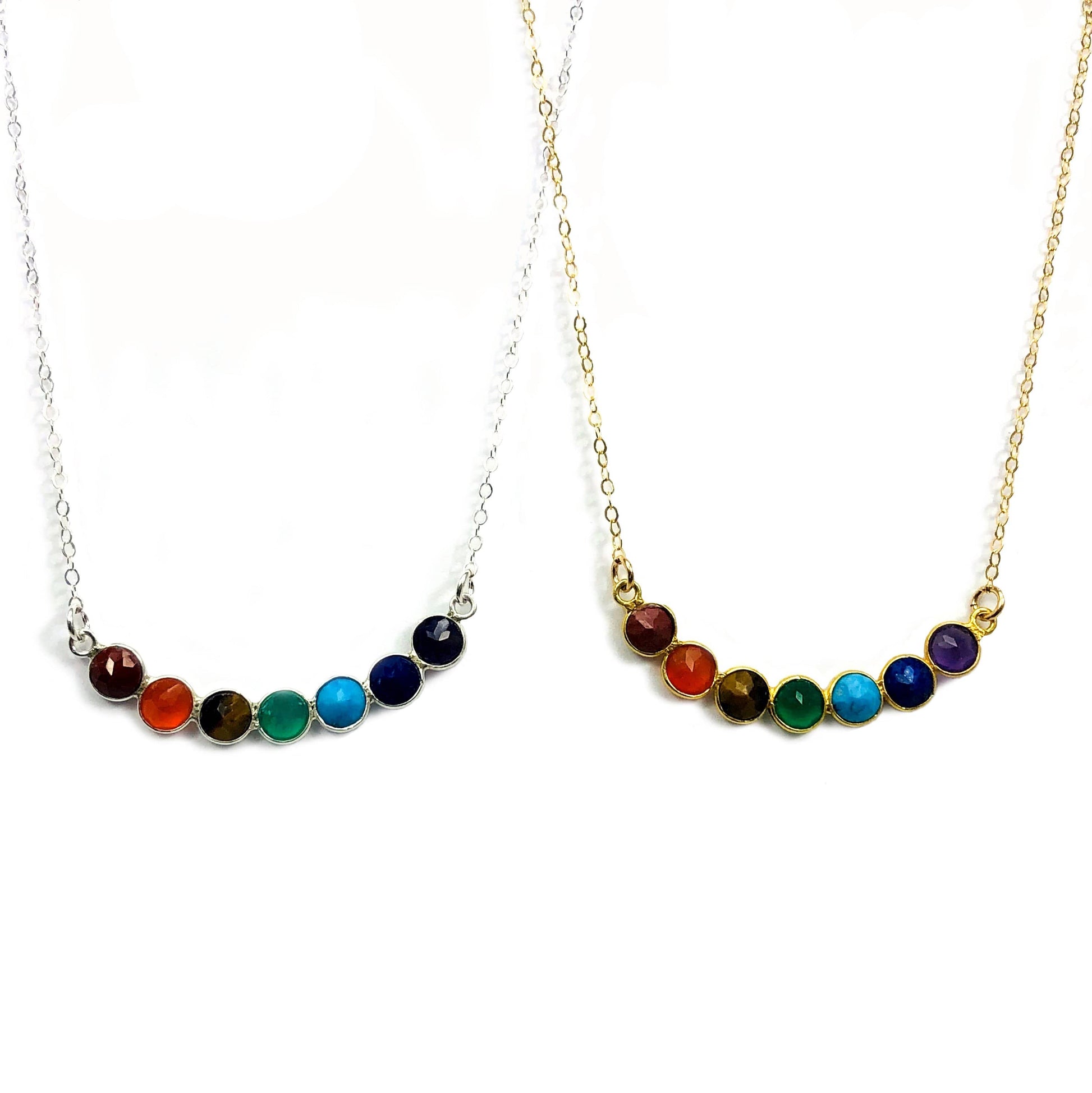 chakra necklaces displayed in gold and silver 