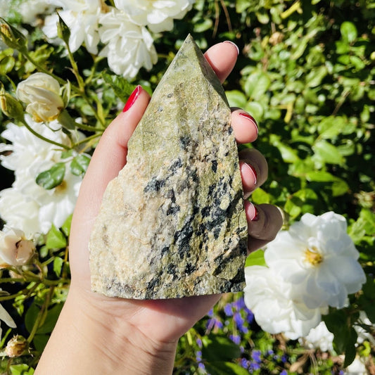Jadeite Semi-polished Point displayed in hand.