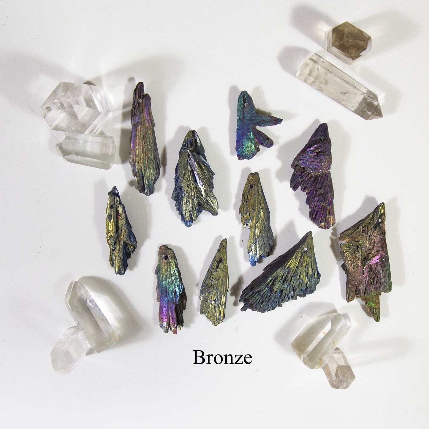 bronze titanium treated kyanite blades on white background