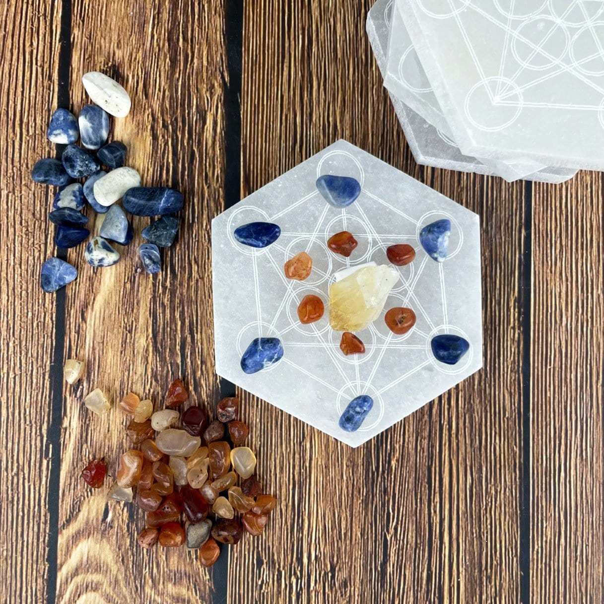 selenite hexagon engraved with metatron symbol with charging stones on engraving