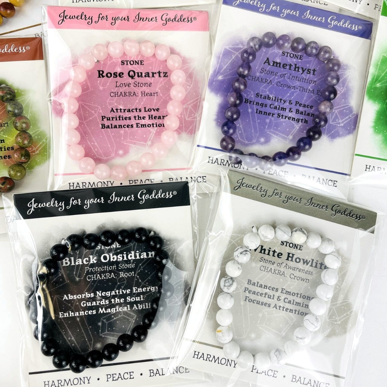 4 of the stones availableMala Gemstone Beaded Stretch Bracelets on their cards