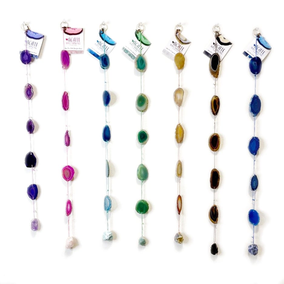 Dyed Agate wall hanging made up of Agate slices strung on complimentary colored cording, finished off with the same color of stone!