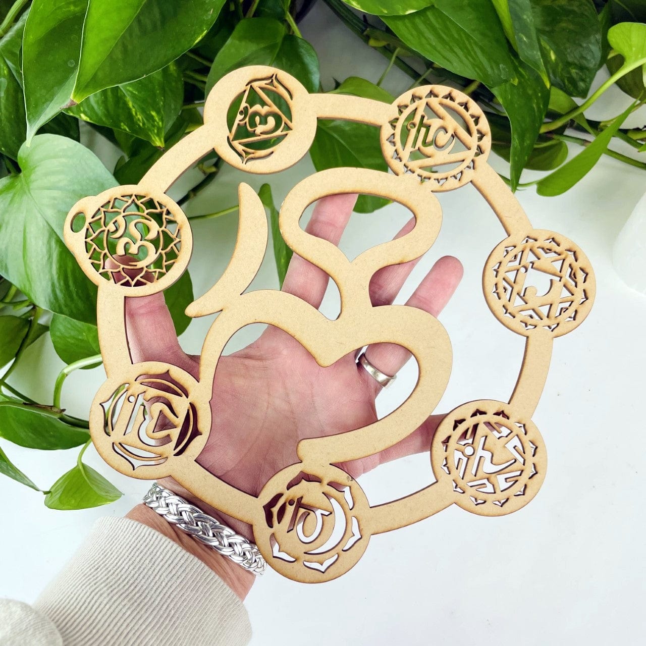 Crystal grid held in a woman's hand