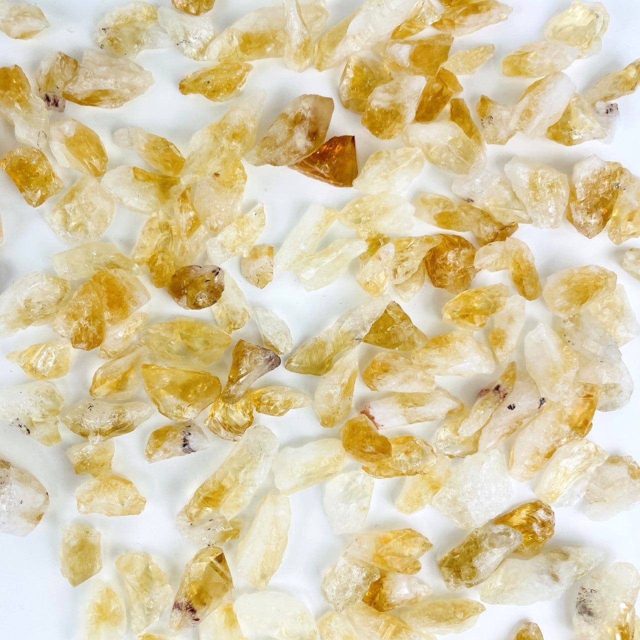 Citrine Stones - Golden Amethyst spread out on a table