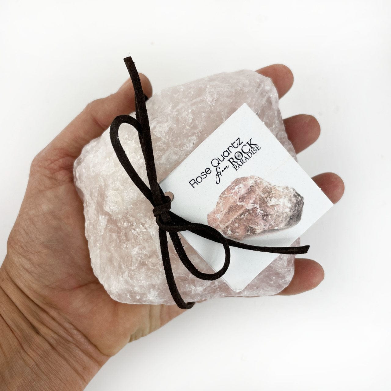 1-2 kilo sized stone in a hand for size reference