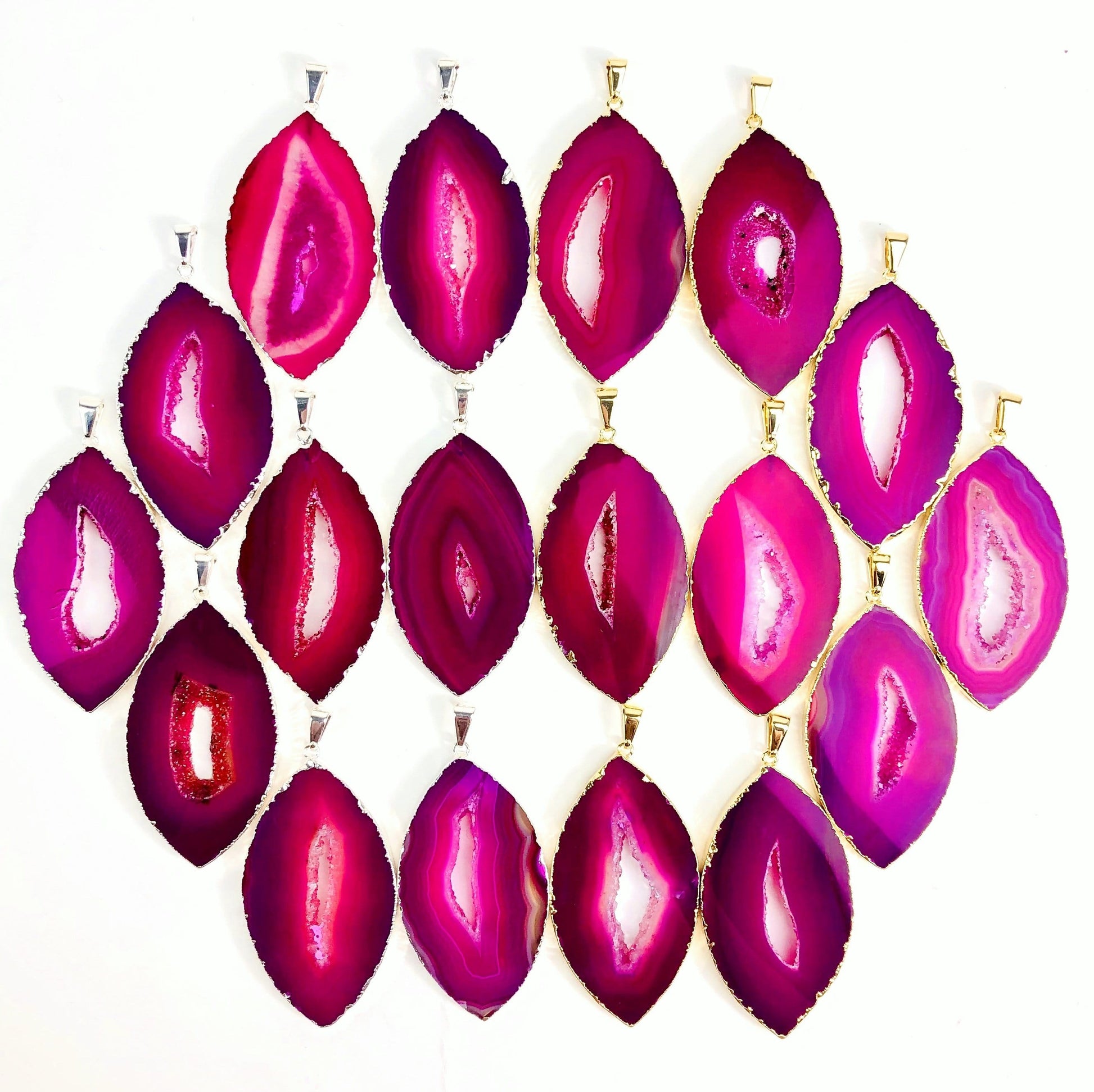 Front facing pink agate druzy marquise shape displaying silver and gold pendants. Color and pattern vary.