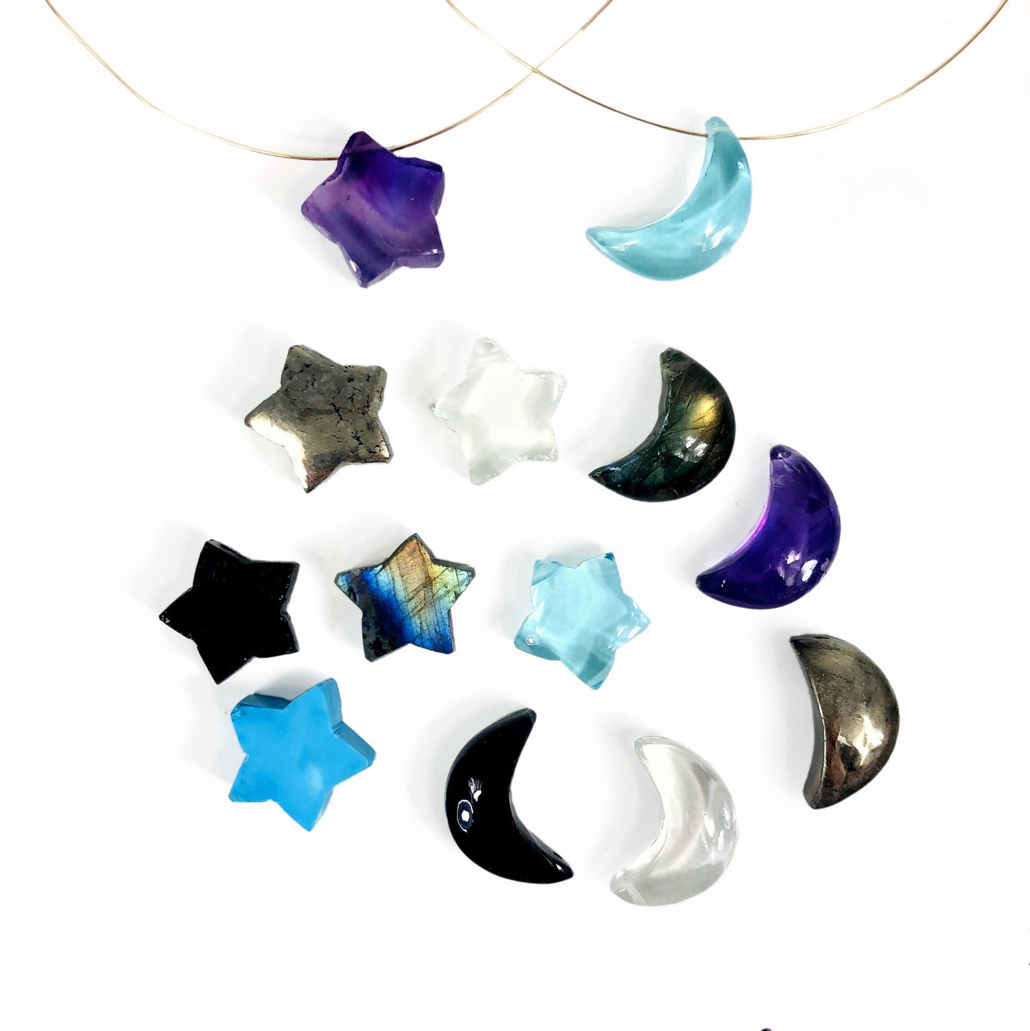 gemstone star and moon beads on a table
